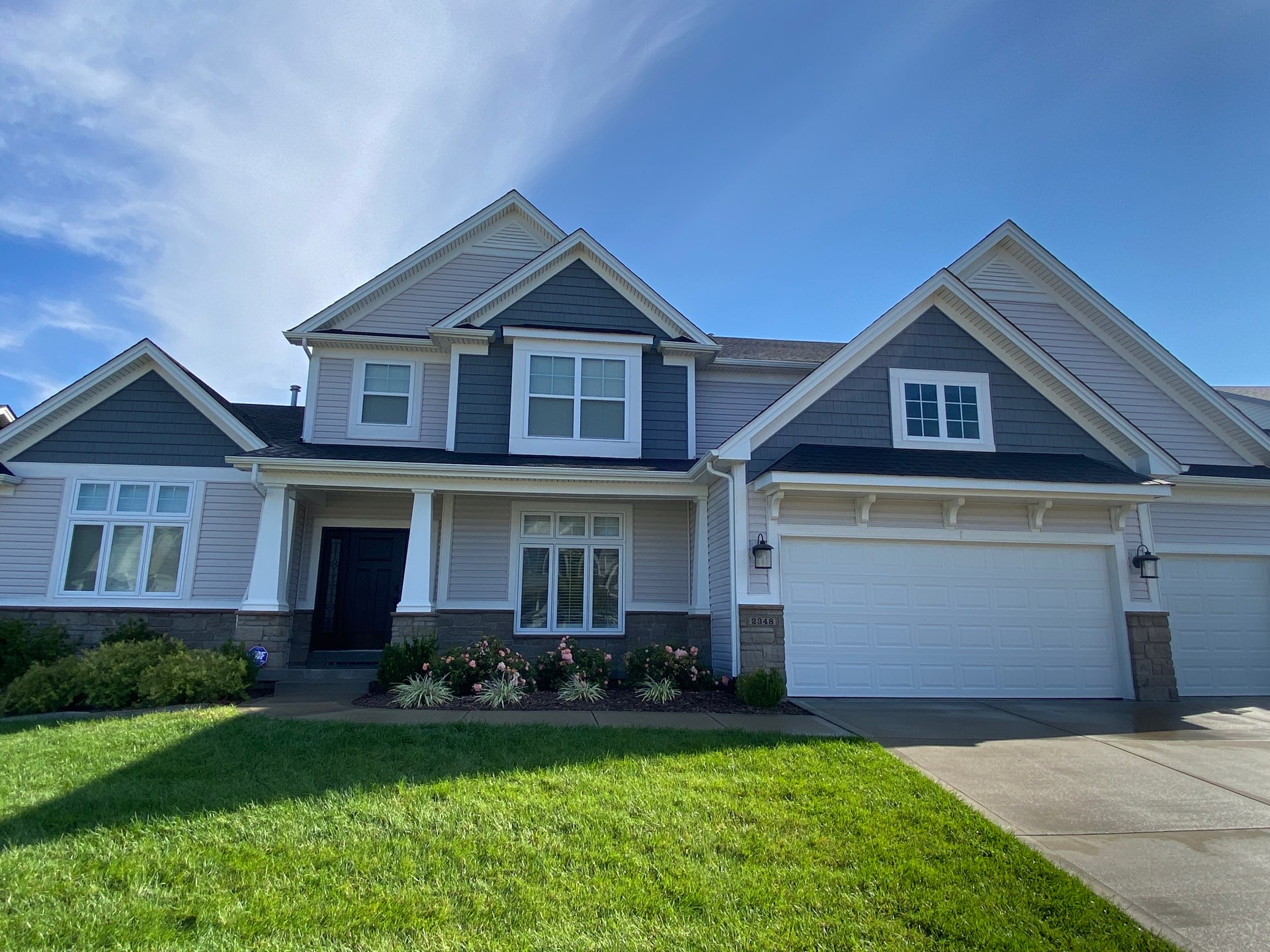 Two-story St. Charles home with freshly soft washed siding