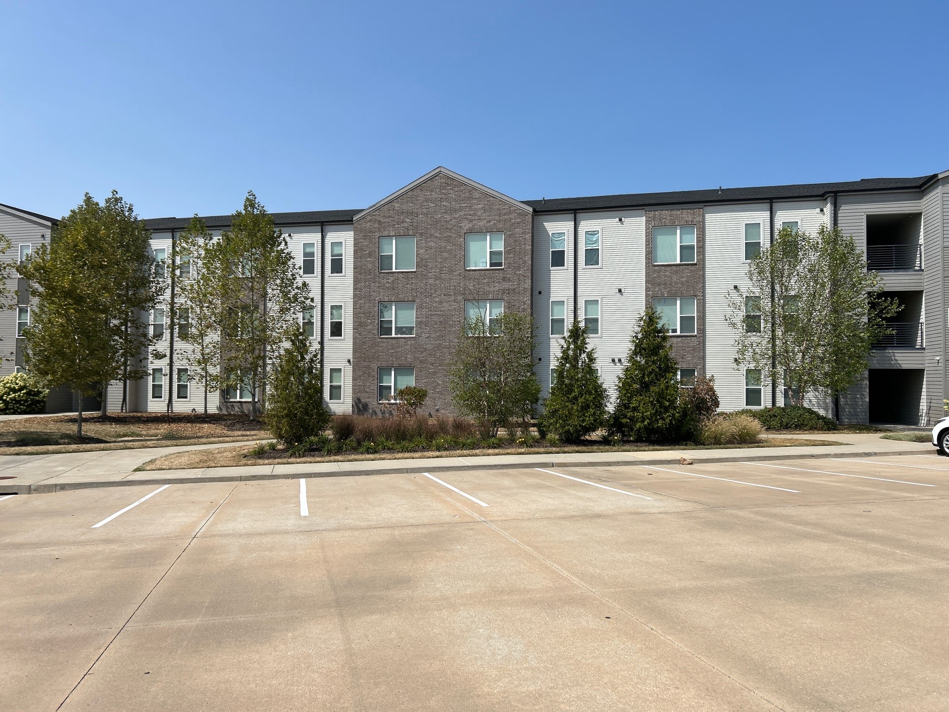 Apartment building and parking area after exterior cleaning